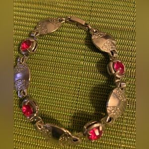 metal bracelet with pink stones